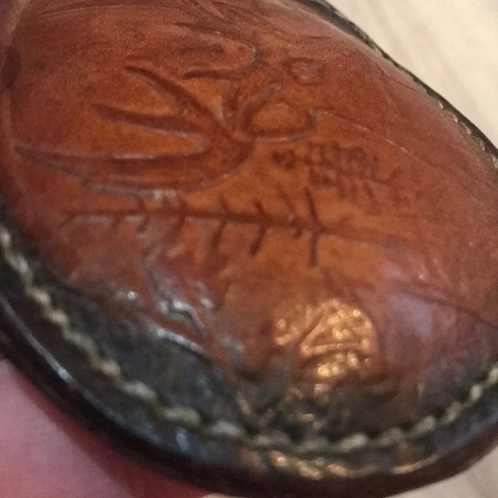 - Handcrafted leather seat belt buckle in brown